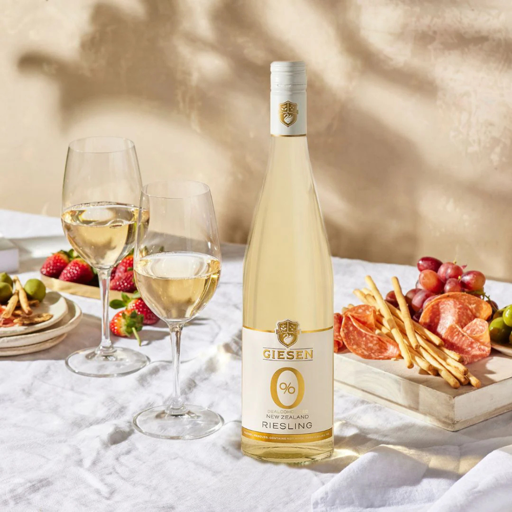 Giesen Riesling poured into two glasses and cheeseboard