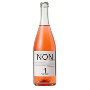 A bottle of Non 1 Zero Raspberry Sparkling Water with a white label and silver cap, filled with pinkish-rose liquid, on a white background.