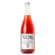 A glass bottle of Non 5 Lemon Marigold Ale, featuring a vibrant pinkish-amber liquid and a white label with black text, set against a plain white background.