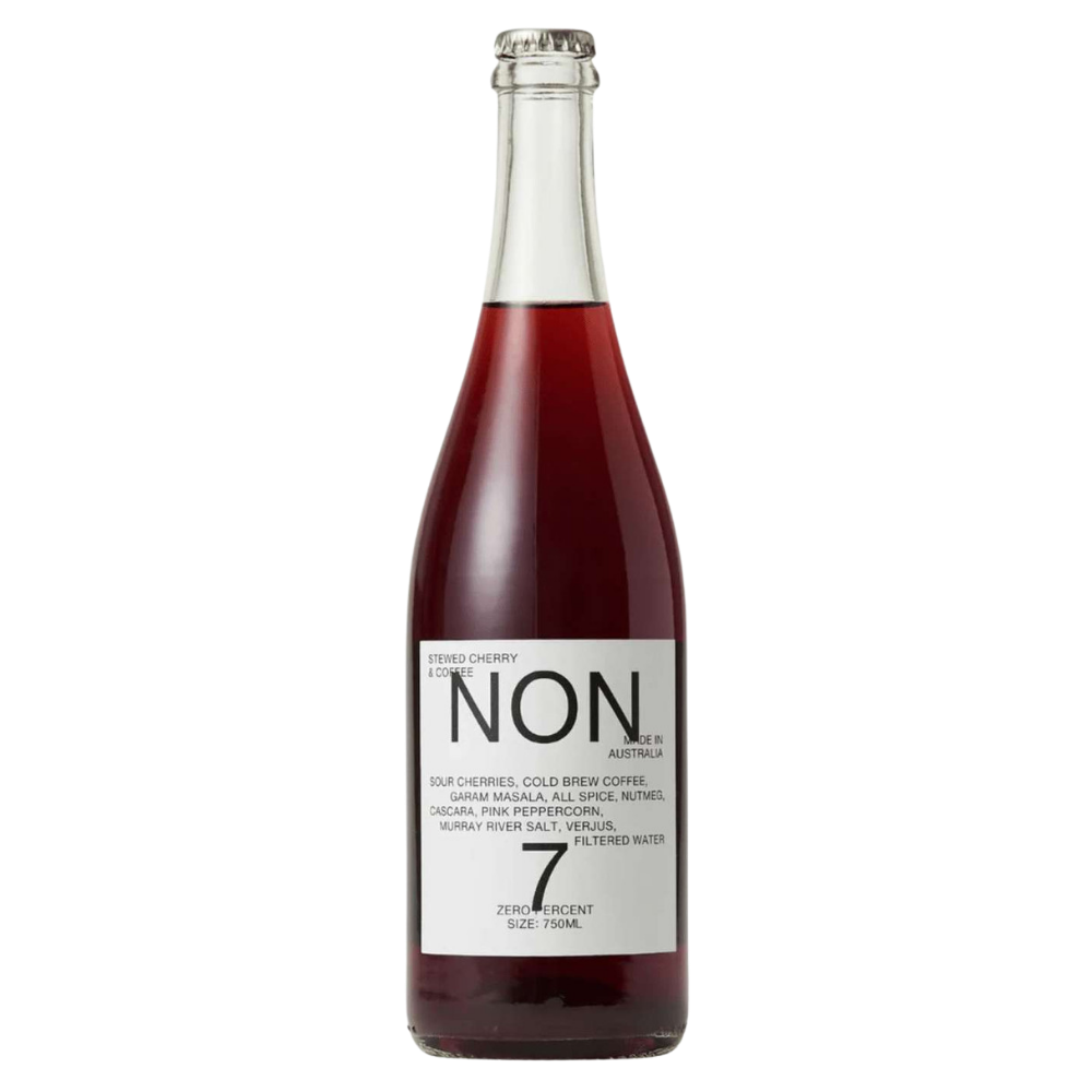 A bottle of Non7 Zero Alcohol 0% ABV wine with dark red liquid, featuring a white label with black text, on a solid white background.