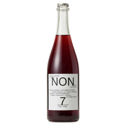 A bottle of Non7 Zero Alcohol 0% ABV wine with dark red liquid, featuring a white label with black text, on a solid white background.