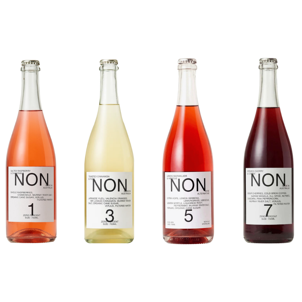 Four glass bottles of NON. Non-Alcoholic Sparkling Wine arranged in a row against a plain white background, showing different wine colors labeled 1, 3, 5, and 7.