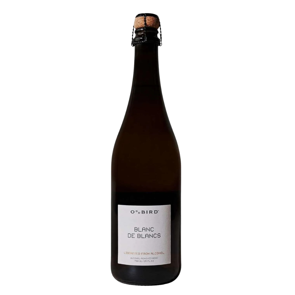 A dark brown glass bottle of O'Bird Blanc de Blancs non-alcoholic sparkling wine, featuring a white label and a dark wire cage closure, set against a plain white background.