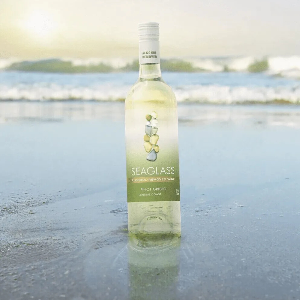 Seaglass wine bottle on a beach with ocean view